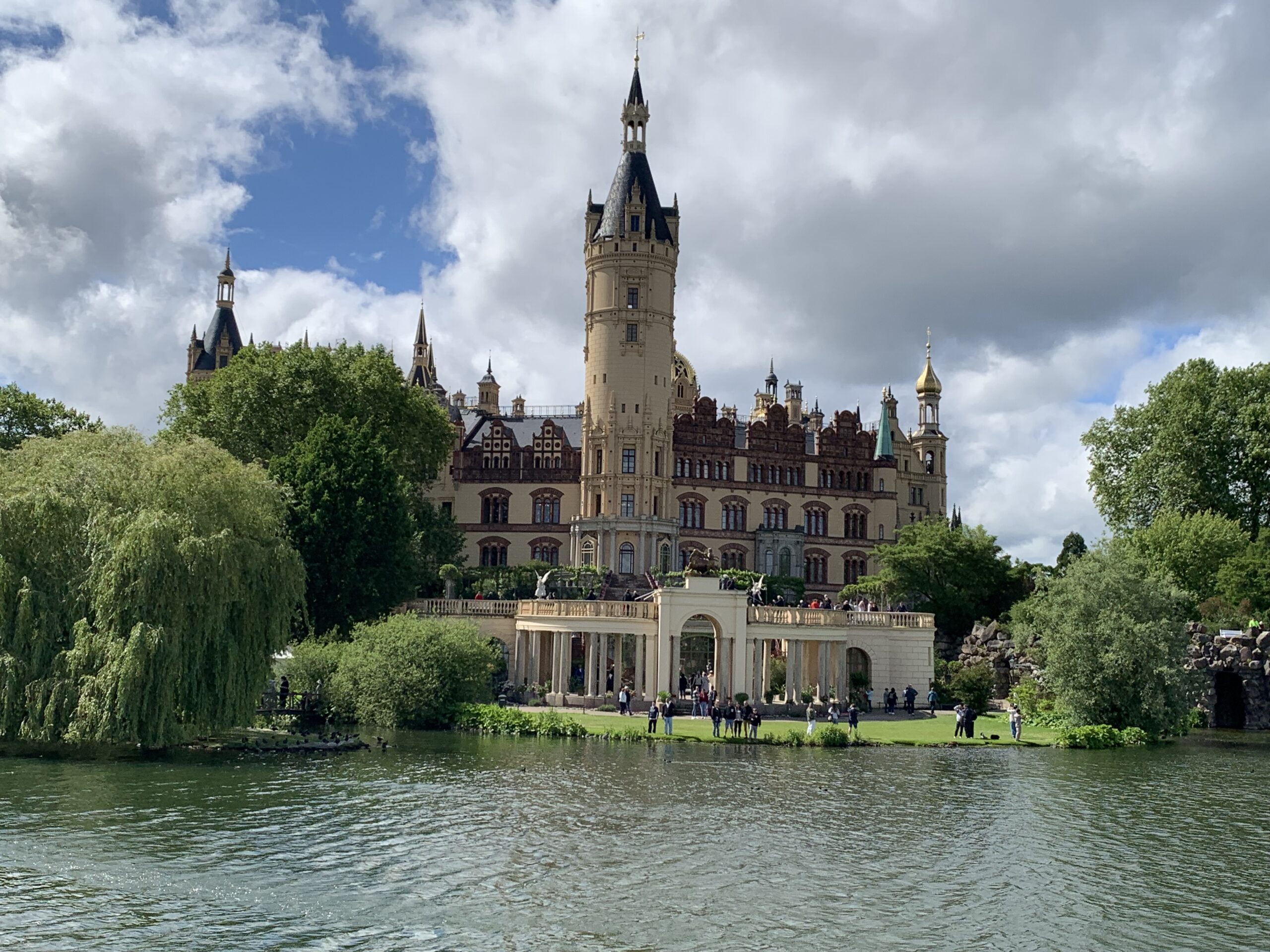 The castle and its elegant orangery, from the water